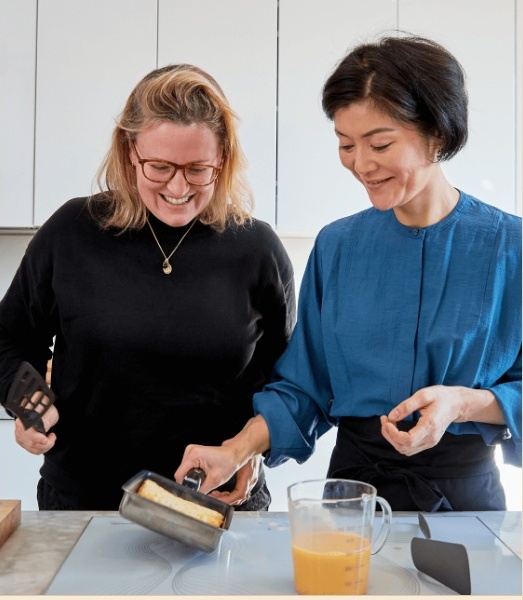 Two people cooking together